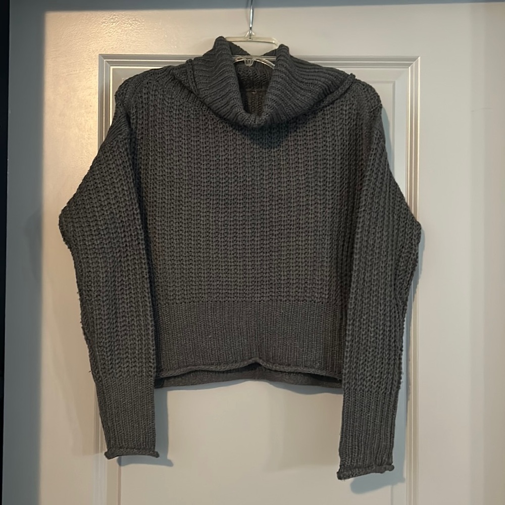 Woman’s grey turtleneck sweater knit